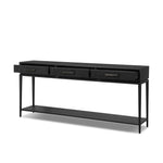 Featuring Rosenell Black Oak Veneer Console Table 78" by Four Hands at Amethyst Home. Elevate your living space or media room with a slim-profile console of black-finished oak. A smooth top pairs with three drawers covered with woven paper cord, while lower open shelving creates bonus storage and display options. The result: a dark, Scandinavian-inspired loo. Amethyst Home provides interior design, new home construction design consulting, vintage area rugs, and lighting in the Monterey metro area.