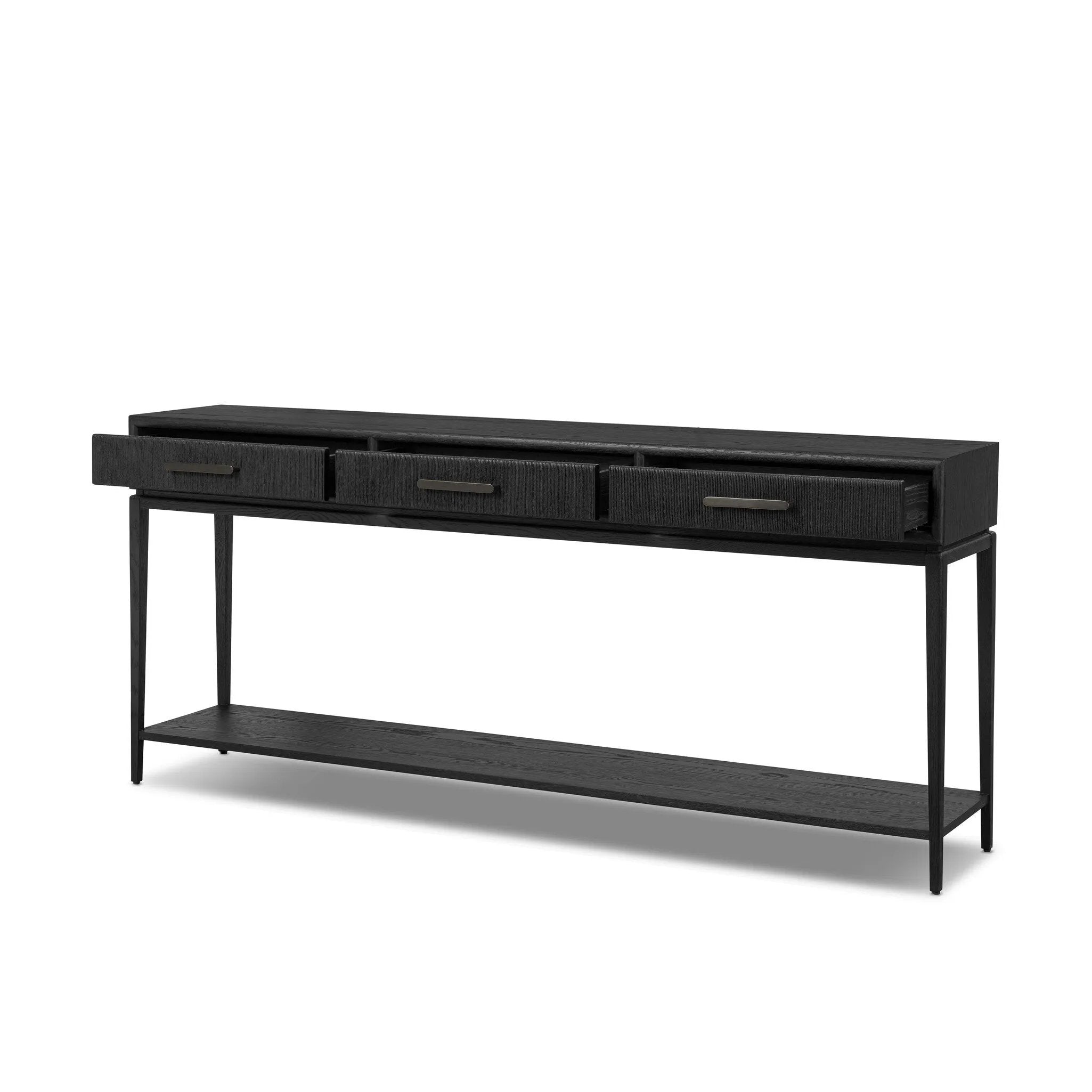 Featuring Rosenell Black Oak Veneer Console Table 78" by Four Hands at Amethyst Home. Elevate your living space or media room with a slim-profile console of black-finished oak. A smooth top pairs with three drawers covered with woven paper cord, while lower open shelving creates bonus storage and display options. The result: a dark, Scandinavian-inspired loo. Amethyst Home provides interior design, new home construction design consulting, vintage area rugs, and lighting in the Monterey metro area.
