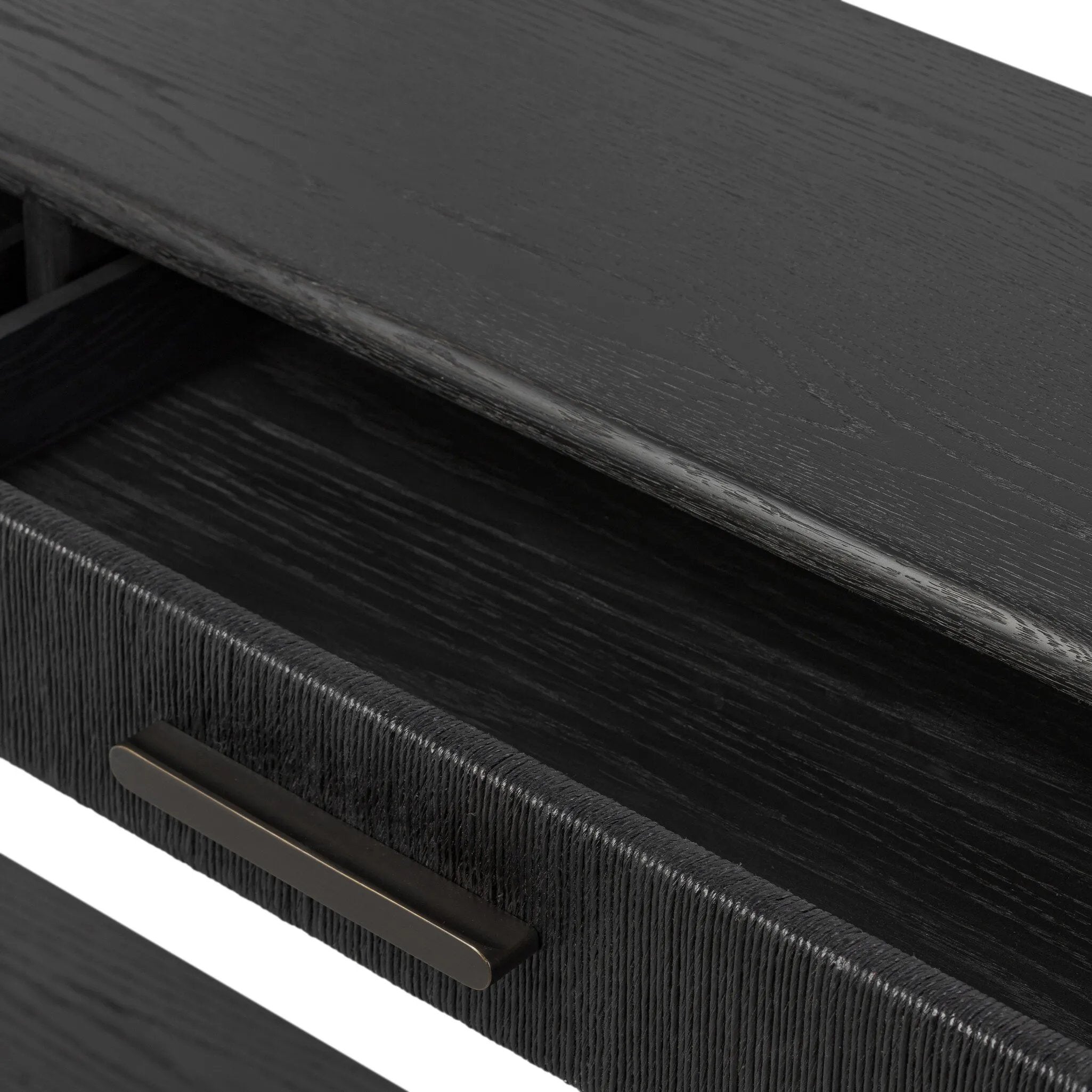 Featuring Rosenell Black Oak Veneer Console Table 78" by Four Hands at Amethyst Home. Elevate your living space or media room with a slim-profile console of black-finished oak. A smooth top pairs with three drawers covered with woven paper cord, while lower open shelving creates bonus storage and display options. The result: a dark, Scandinavian-inspired look t. Amethyst Home provides interior design, new home construction design consulting, vintage area rugs, and lighting in the Tampa metro area.