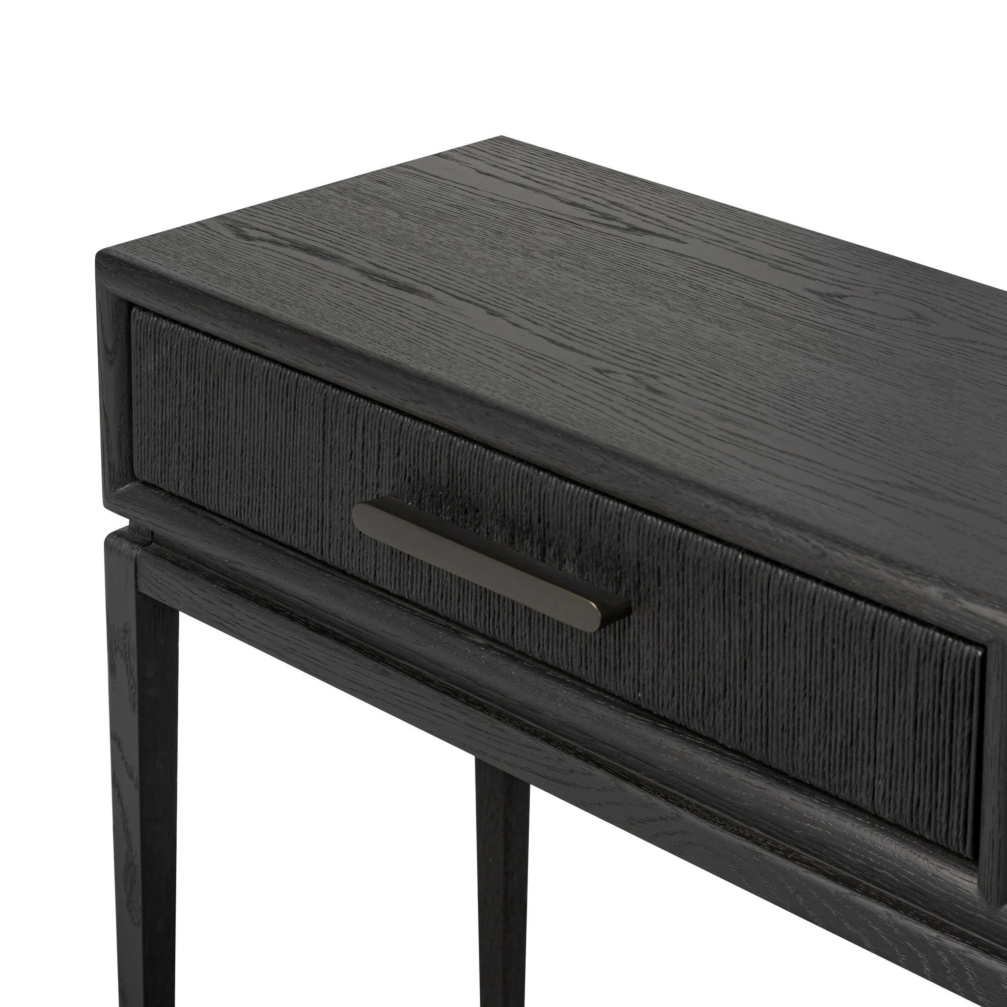 Featuring Rosenell Black Oak Veneer Console Table 78" by Four Hands at Amethyst Home. Elevate your living space or media room with a slim-profile console of black-finished oak. A smooth top pairs with three drawers covered with woven paper cord, while lower open shelving creates bonus storage and display options. The result: a dark, Scandinavian-inspired l. Amethyst Home provides interior design, new home construction design consulting, vintage area rugs, and lighting in the Washington metro area.