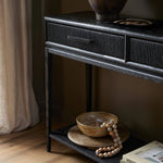 Featuring Rosenell Black Oak Veneer Console Table 78" by Four Hands at Amethyst Home. Elevate your living space or media room with a slim-profile console of black-finished oak. A smooth top pairs with three drawers covered with woven paper cord, while lower open shelving creates bonus storage and display options. The result: a dark, Scandinavian-inspire. Amethyst Home provides interior design, new home construction design consulting, vintage area rugs, and lighting in the Winter Garden metro area.