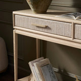 Featuring Rosenell Natural Oak Veneer Console Table 60" by Four Hands at Amethyst Home. Elevate your living space or media room with a slim-profile console of light, natural oak. A smooth top pairs with two drawers covered with woven paper cord, while lower open shelving creates bonus storage and display options. The result: a clean, Scandinavian-inspire. Amethyst Home provides interior design, new home construction design consulting, vintage area rugs, and lighting in the Laguna Beach metro area.