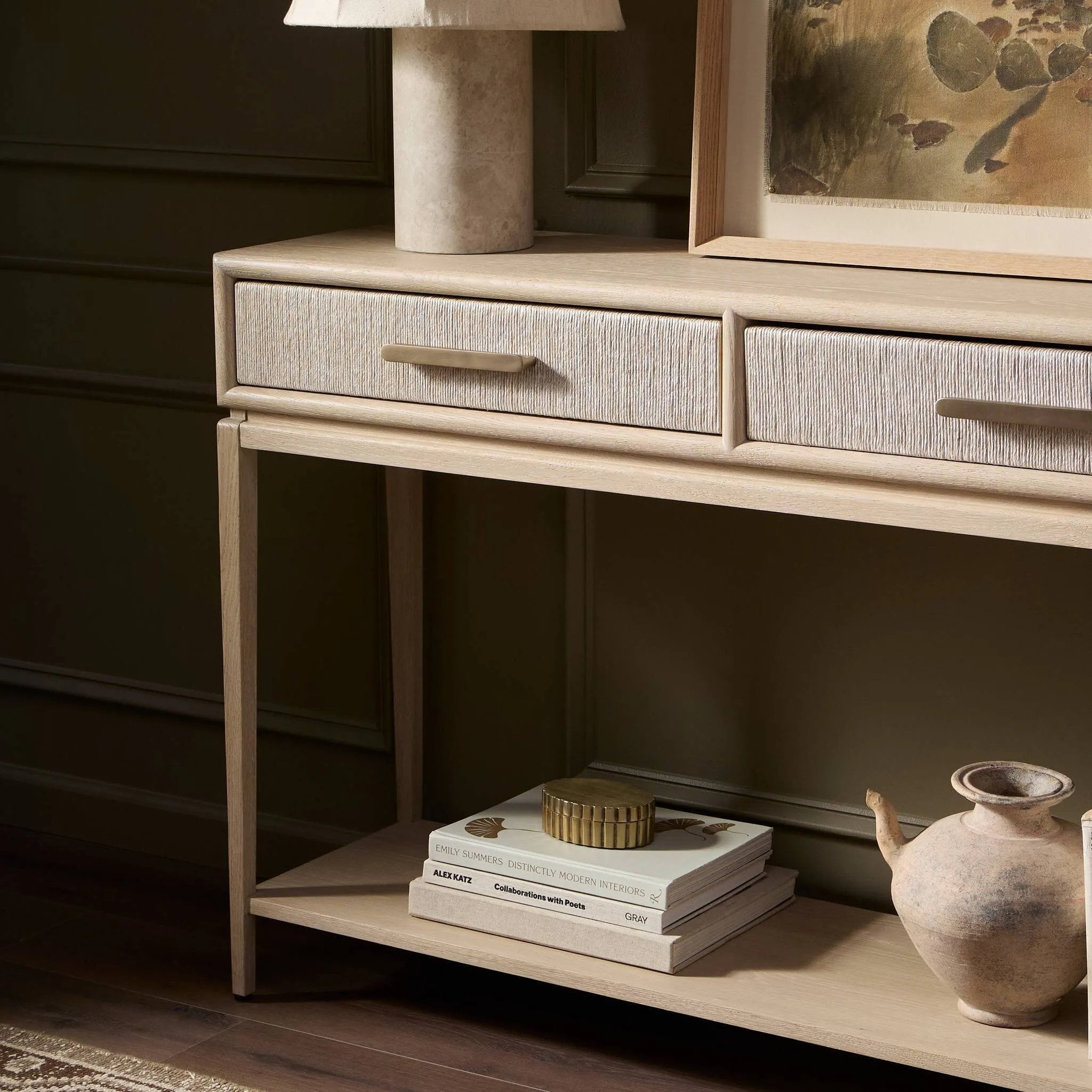 Featuring Rosenell Natural Oak Veneer Console Table 78" by Four Hands at Amethyst Home. Elevate your living space or media room with a slim-profile console of light, natural oak. A smooth top pairs with three drawers covered with woven paper cord, while lower open shelving creates bonus storage and display options. The result: a clean, Scandinavian-inspired loo. Amethyst Home provides interior design, new home construction design consulting, vintage area rugs, and lighting in the Miami metro area.