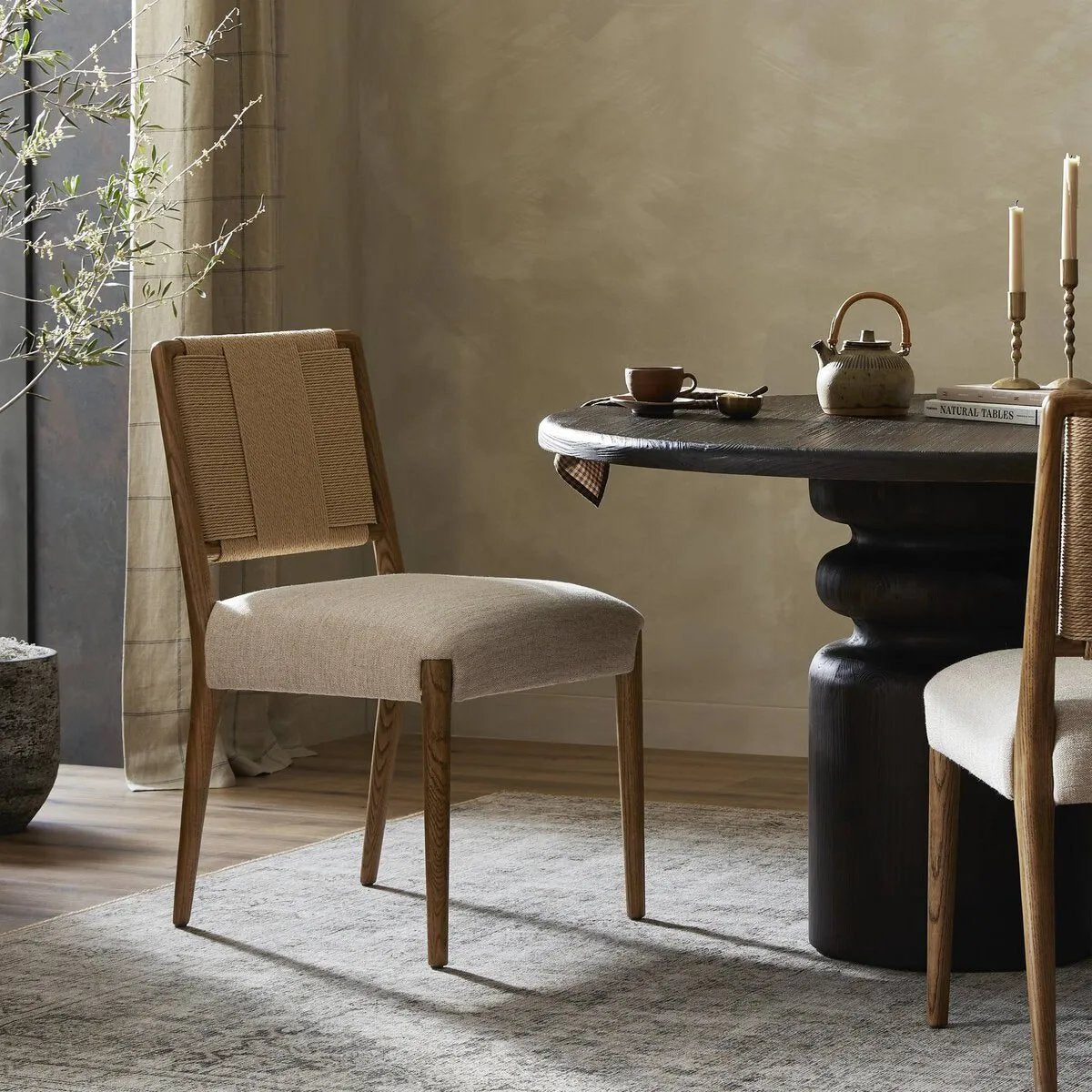 Featuring Rothler Alcala Wheat Dining Chair by Four Hands at Amethyst Home. Enhance your dining experience with the Rothler Alcala Wheat Dining Chair. Crafted with high-quality materials, this dining chair provides both comfort and style. Its elegant design adds a touch of sophistication to any dining room. Get ready to dine in luxury. 
Overall Dimensions:. Amethyst Home provides interior design, new home construction design consulting, vintage area rugs, and lighting in the Alpharetta metro area.