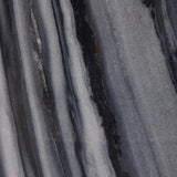 Precise curves add up to modern presence. Bold ebony marble is carved from a single piece of stone and turned on a lathe to form the curves and angles of this end table Amethyst Home provides interior design, new home construction design consulting, vintage area rugs, and lighting in the Dallas metro area.