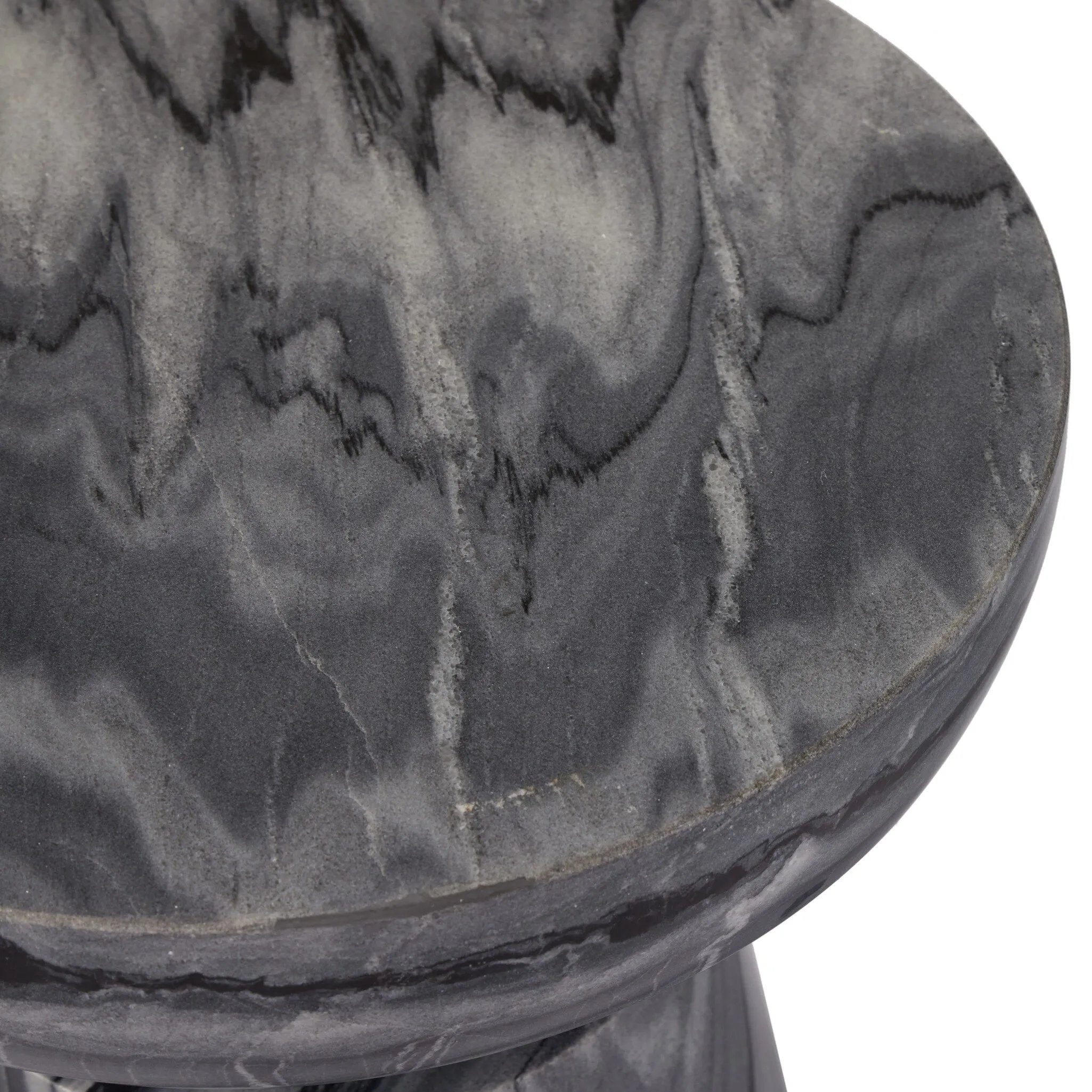 Precise curves add up to modern presence. Bold ebony marble is carved from a single piece of stone and turned on a lathe to form the curves and angles of this end table Amethyst Home provides interior design, new home construction design consulting, vintage area rugs, and lighting in the Des Moines metro area.