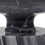 Precise curves add up to modern presence. Bold ebony marble is carved from a single piece of stone and turned on a lathe to form the curves and angles of this end table Amethyst Home provides interior design, new home construction design consulting, vintage area rugs, and lighting in the Laguna Beach metro area.