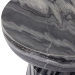 Precise curves add up to modern presence. Bold ebony marble is carved from a single piece of stone and turned on a lathe to form the curves and angles of this end table Amethyst Home provides interior design, new home construction design consulting, vintage area rugs, and lighting in the San Diego metro area.