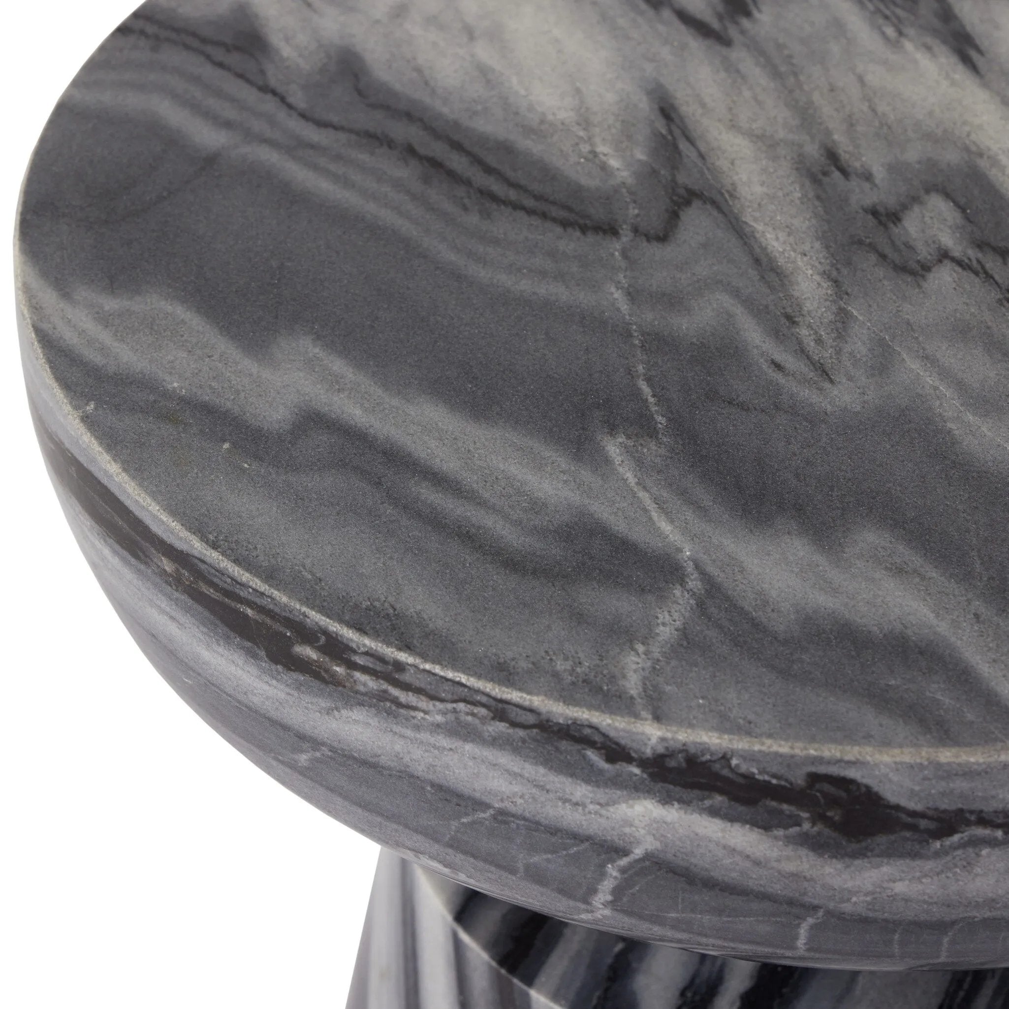 Precise curves add up to modern presence. Bold ebony marble is carved from a single piece of stone and turned on a lathe to form the curves and angles of this end table Amethyst Home provides interior design, new home construction design consulting, vintage area rugs, and lighting in the San Diego metro area.