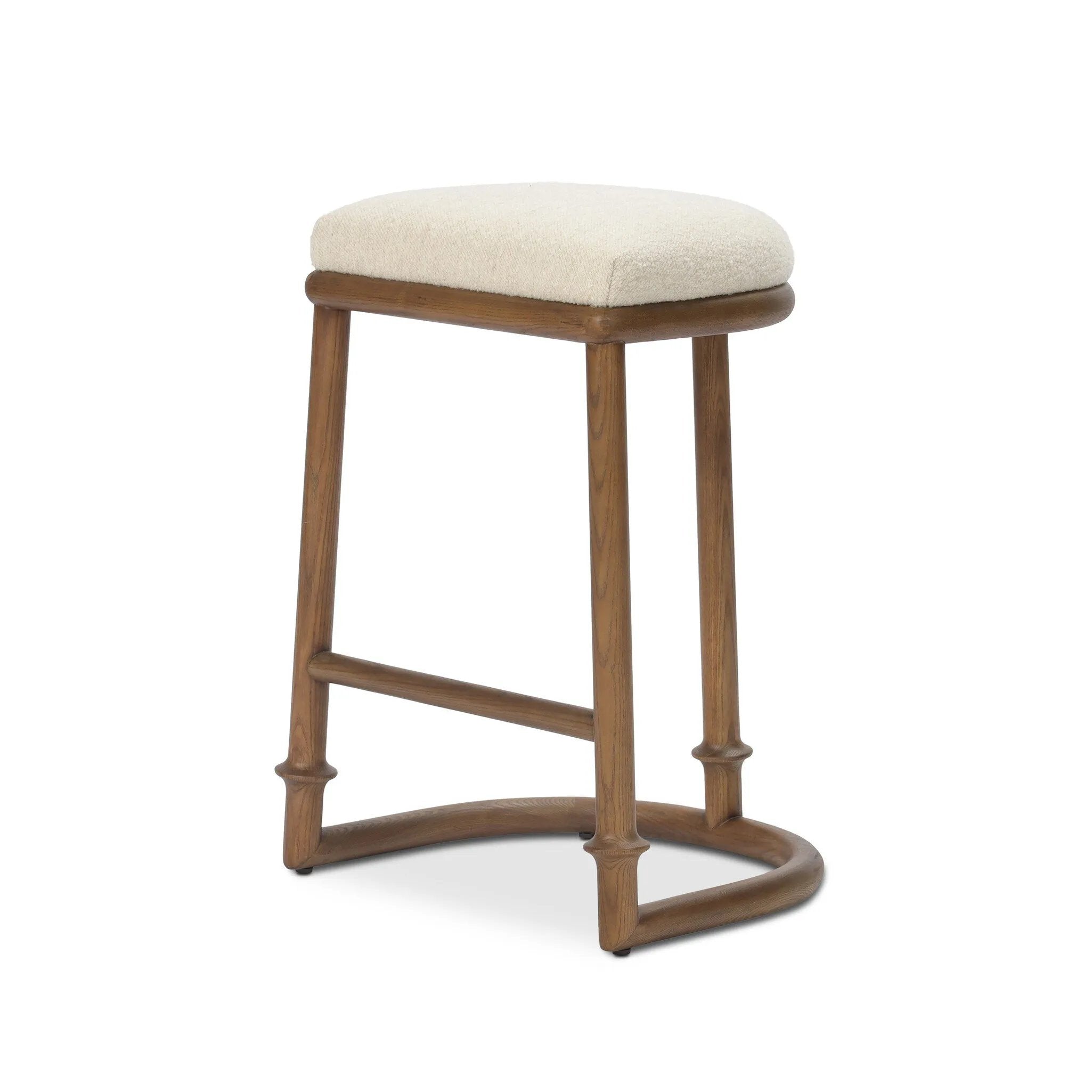 A simple backless stool pairs antique walnut-finished solid ash and high-performance fabric, for a warm, light look. A backless cylinder frame featured tapering for extra stability, with disc-like turning at the bottom for a heritage design detail. Perfectly sized for the counter. Amethyst Home provides interior design, new home construction design consulting, vintage area rugs, and lighting in the Alpharetta metro area.