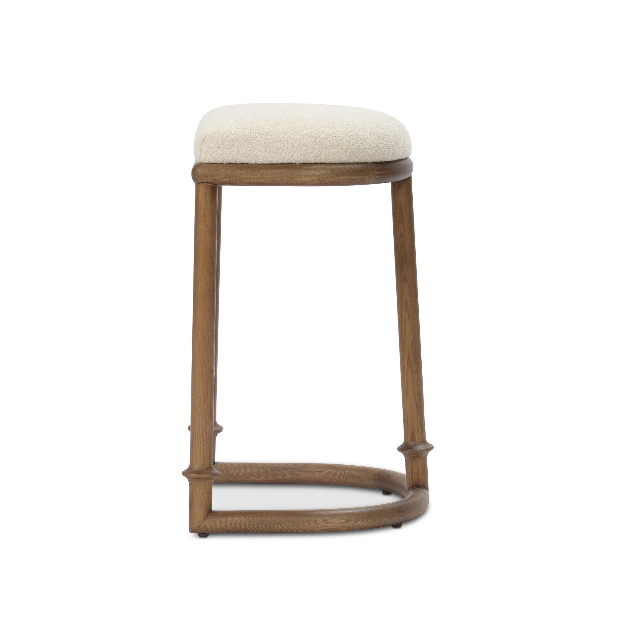 A simple backless stool pairs antique walnut-finished solid ash and high-performance fabric, for a warm, light look. A backless cylinder frame featured tapering for extra stability, with disc-like turning at the bottom for a heritage design detail. Perfectly sized for the counter. Amethyst Home provides interior design, new home construction design consulting, vintage area rugs, and lighting in the Portland metro area.