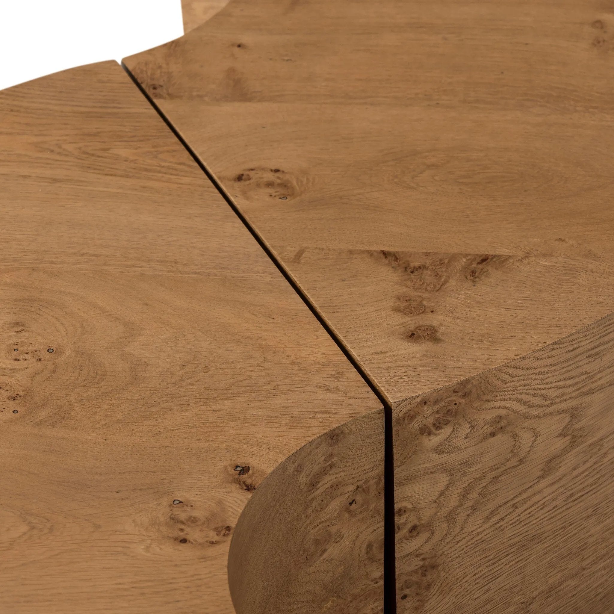 A coffee table that moves with you. Made from oak burl veneer with beautiful movement, this three-piece design pulls apart to create different looks and configurations based on your needs. Pushed together, individual pieces shape a circle; create a wave shape touching just the end pieces together — or, style all three apart. Amethyst Home provides interior design, new home construction design consulting, vintage area rugs, and lighting in the Monterey metro area.