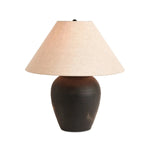 Featuring Russo Aged Black Terracotta Table Lamp by Four Hands at Amethyst Home. In this black terra cotta vase table lamp, each piece bears unique touches from its natural finishing process. Topped with a shade of natural linen, for a textural contrast.
Overall Dimensions: 20.0" L x 20.0 " W x 22.0" H
Materials: Terracotta, 100% Flax/Linen, IronWeight: 10.. Amethyst Home provides interior design, new home construction design consulting, vintage area rugs, and lighting in the Nashville metro area.