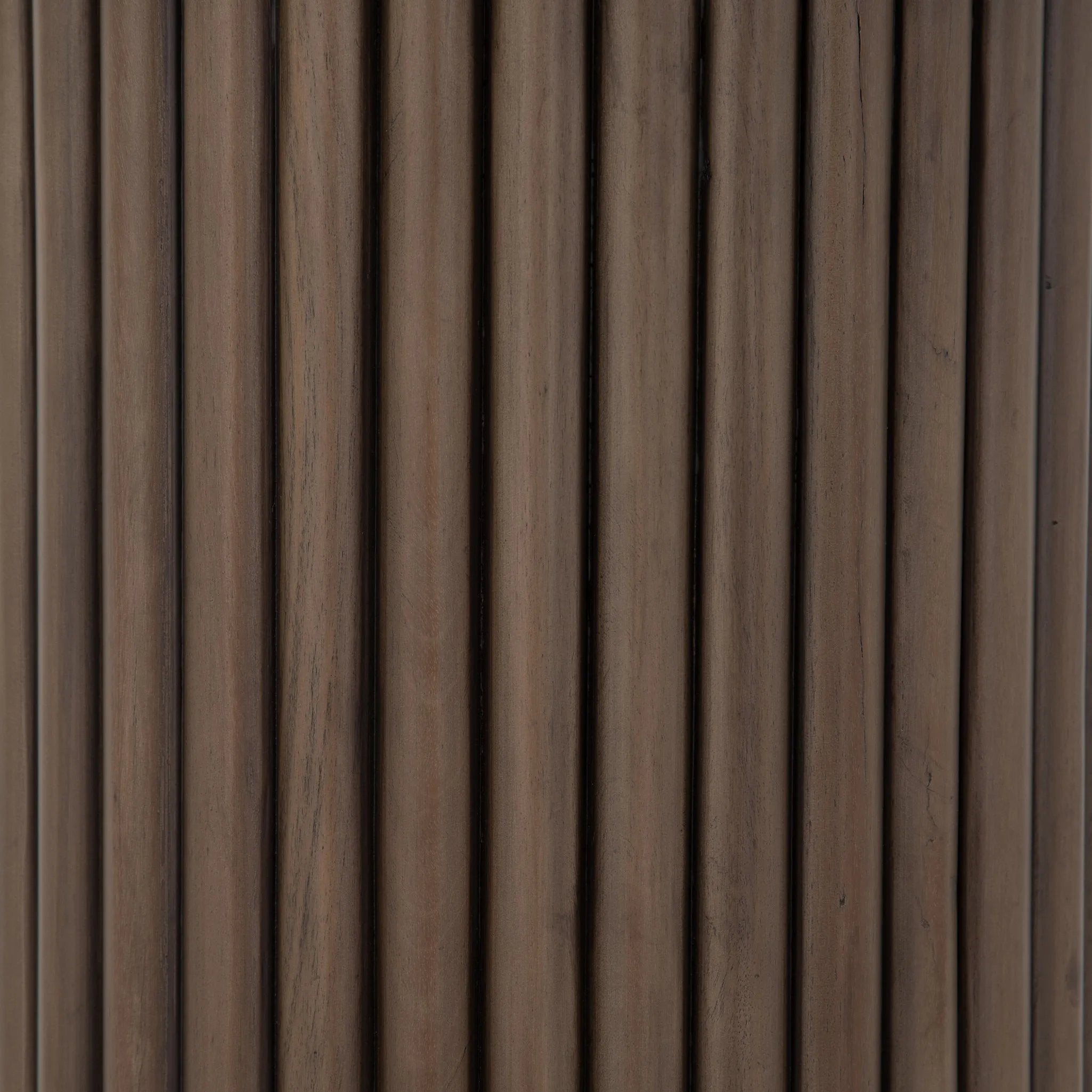 Inspired by décor in the majestic palaces of Jaipur, a conversation-starting end table is made from mixed reclaimed woods, with a rounded top and base with vertical reeding Amethyst Home provides interior design, new home construction design consulting, vintage area rugs, and lighting in the Dallas metro area.