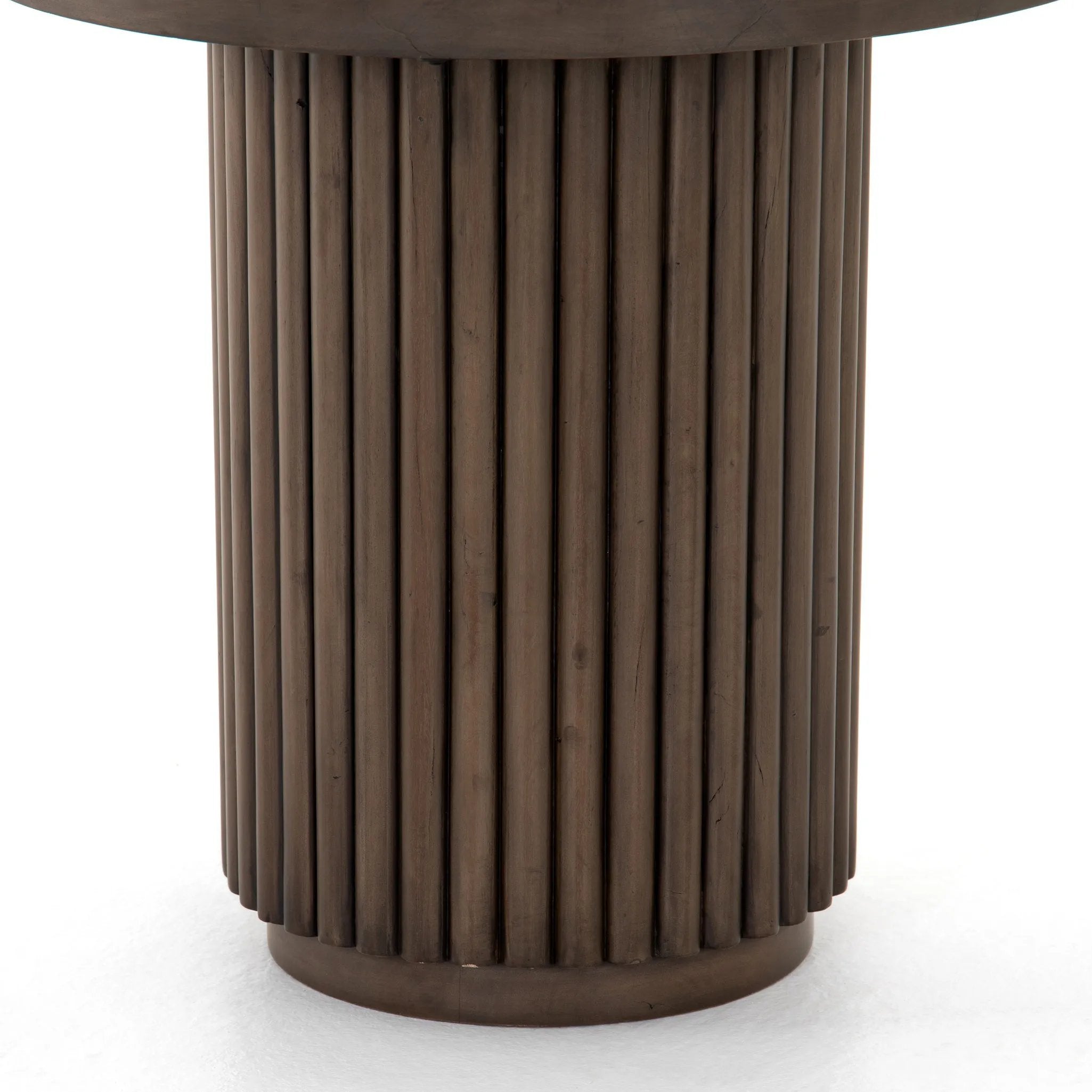 Inspired by décor in the majestic palaces of Jaipur, a conversation-starting end table is made from mixed reclaimed woods, with a rounded top and base with vertical reeding Amethyst Home provides interior design, new home construction design consulting, vintage area rugs, and lighting in the Des Moines metro area.