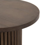 Inspired by décor in the majestic palaces of Jaipur, a conversation-starting end table is made from mixed reclaimed woods, with a rounded top and base with vertical reeding Amethyst Home provides interior design, new home construction design consulting, vintage area rugs, and lighting in the Omaha metro area.