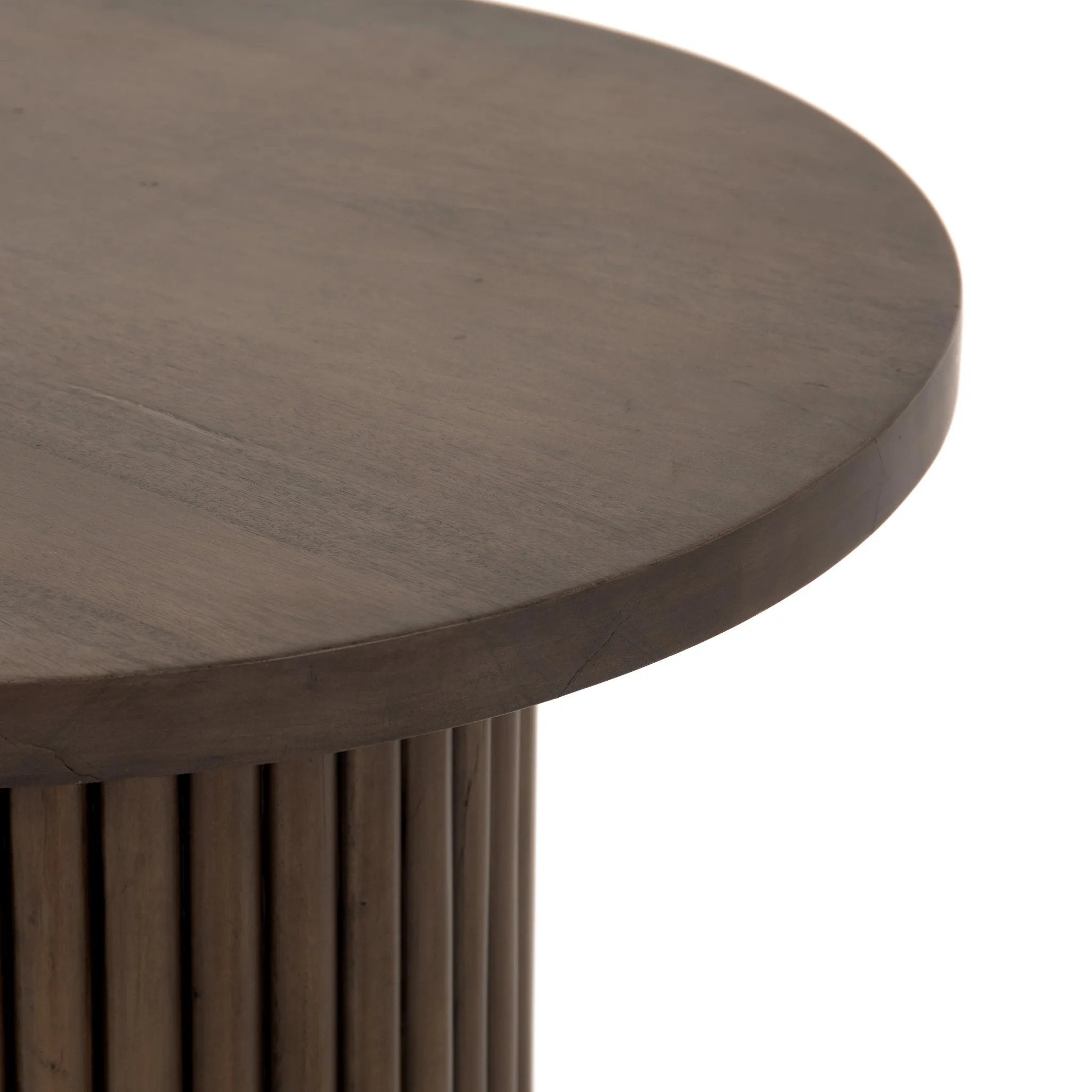 Inspired by décor in the majestic palaces of Jaipur, a conversation-starting end table is made from mixed reclaimed woods, with a rounded top and base with vertical reeding Amethyst Home provides interior design, new home construction design consulting, vintage area rugs, and lighting in the Omaha metro area.