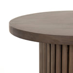 Inspired by décor in the majestic palaces of Jaipur, a conversation-starting end table is made from mixed reclaimed woods, with a rounded top and base with vertical reeding Amethyst Home provides interior design, new home construction design consulting, vintage area rugs, and lighting in the Portland metro area.