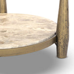 Featuring Ruthie Fossil Marble End Table by Four Hands at Amethyst Home. Work a heritage-inspired piece into your collection with a tiered end table of hammered iron in an aged brass. With inset marble shelves and turn-style legs, this table's fine details bring an elevated, artisan look to any space. Perfectly sized to keep your favorite book or drink on. Amethyst Home provides interior design, new home construction design consulting, vintage area rugs, and lighting in the Los Angeles metro area.