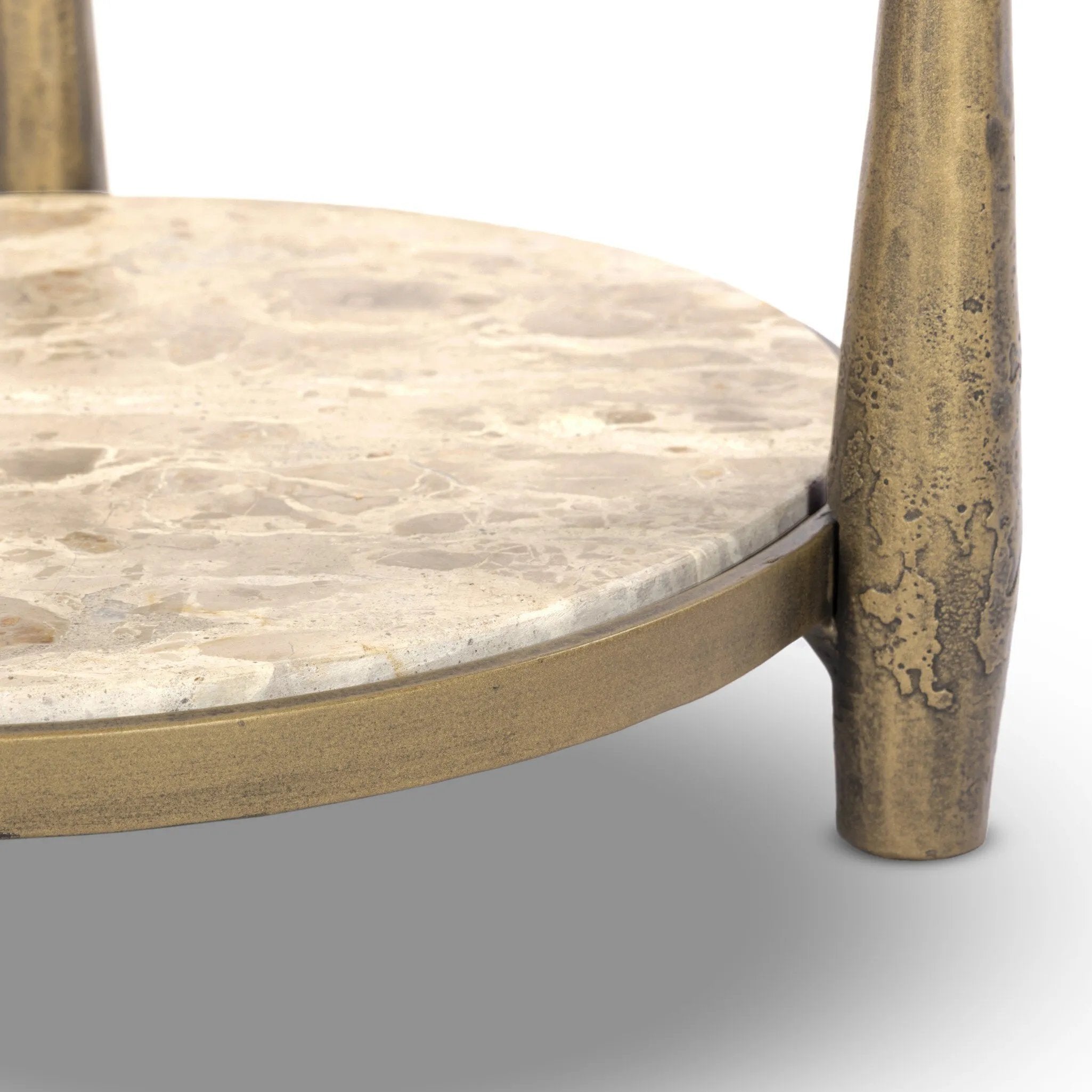 Featuring Ruthie Fossil Marble End Table by Four Hands at Amethyst Home. Work a heritage-inspired piece into your collection with a tiered end table of hammered iron in an aged brass. With inset marble shelves and turn-style legs, this table's fine details bring an elevated, artisan look to any space. Perfectly sized to keep your favorite book or drink on. Amethyst Home provides interior design, new home construction design consulting, vintage area rugs, and lighting in the Los Angeles metro area.