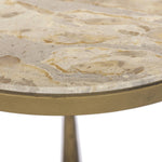 Featuring Ruthie Fossil Marble End Table by Four Hands at Amethyst Home. Work a heritage-inspired piece into your collection with a tiered end table of hammered iron in an aged brass. With inset marble shelves and turn-style legs, this table's fine details bring an elevated, artisan look to any space. Perfectly sized to keep your favorite book or drink. Amethyst Home provides interior design, new home construction design consulting, vintage area rugs, and lighting in the Salt Lake City metro area.