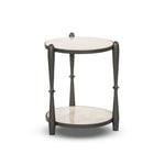 Featuring Ruthie Lunar Marble End Table by Four Hands at Amethyst Home. Work a heritage-inspired piece into your collection with a tiered end table of hammered iron in a hammered gunmetal. With inset marble shelves and turn-style legs, this table's fine details bring an elevated, artisan look to any space. Perfectly sized to keep your favorite book or drink on. Amethyst Home provides interior design, new home construction design consulting, vintage area rugs, and lighting in the Boston metro area.