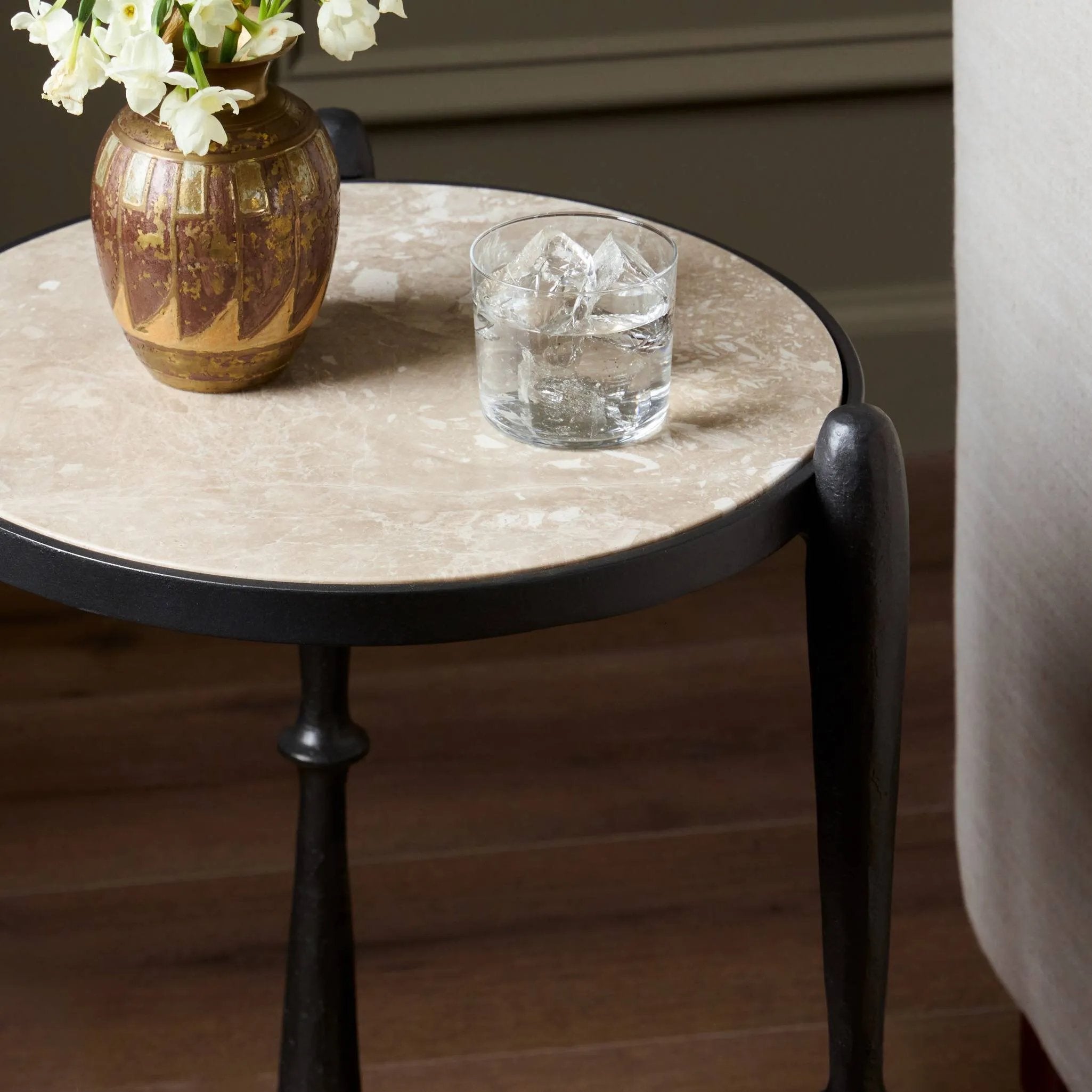 Featuring Ruthie Lunar Marble End Table by Four Hands at Amethyst Home. Work a heritage-inspired piece into your collection with a tiered end table of hammered iron in a hammered gunmetal. With inset marble shelves and turn-style legs, this table's fine details bring an elevated, artisan look to any space. Perfectly sized to keep your favorite book or drink . Amethyst Home provides interior design, new home construction design consulting, vintage area rugs, and lighting in the Monterey metro area.