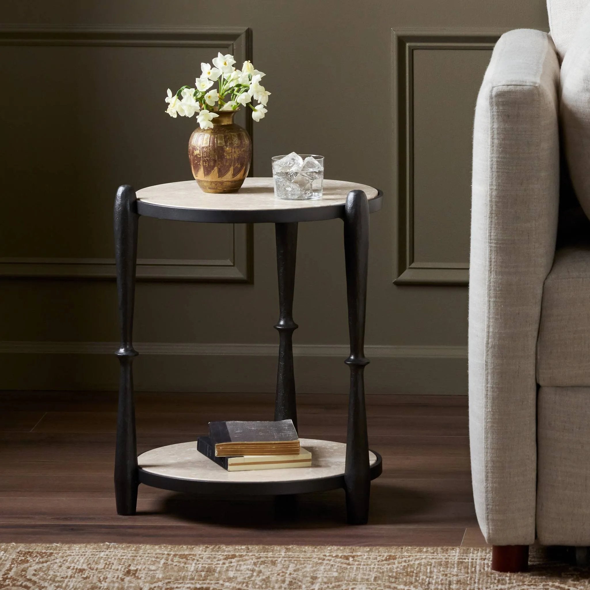 Work a heritage-inspired piece into your collection with a tiered end table of hammered iron in a hammered gunmetal. With inset marble shelves and turn-style legs, this table's fine details bring an elevated, artisan look to any space. Perfectly sized to keep your favorite book or drink on hand Amethyst Home provides interior design, new home construction design consulting, vintage area rugs, and lighting in the Omaha metro area.