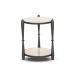 Featuring Ruthie Lunar Marble End Table by Four Hands at Amethyst Home. Work a heritage-inspired piece into your collection with a tiered end table of hammered iron in a hammered gunmetal. With inset marble shelves and turn-style legs, this table's fine details bring an elevated, artisan look to any space. Perfectly sized to keep your favorite book or drink. Amethyst Home provides interior design, new home construction design consulting, vintage area rugs, and lighting in the Park City metro area.