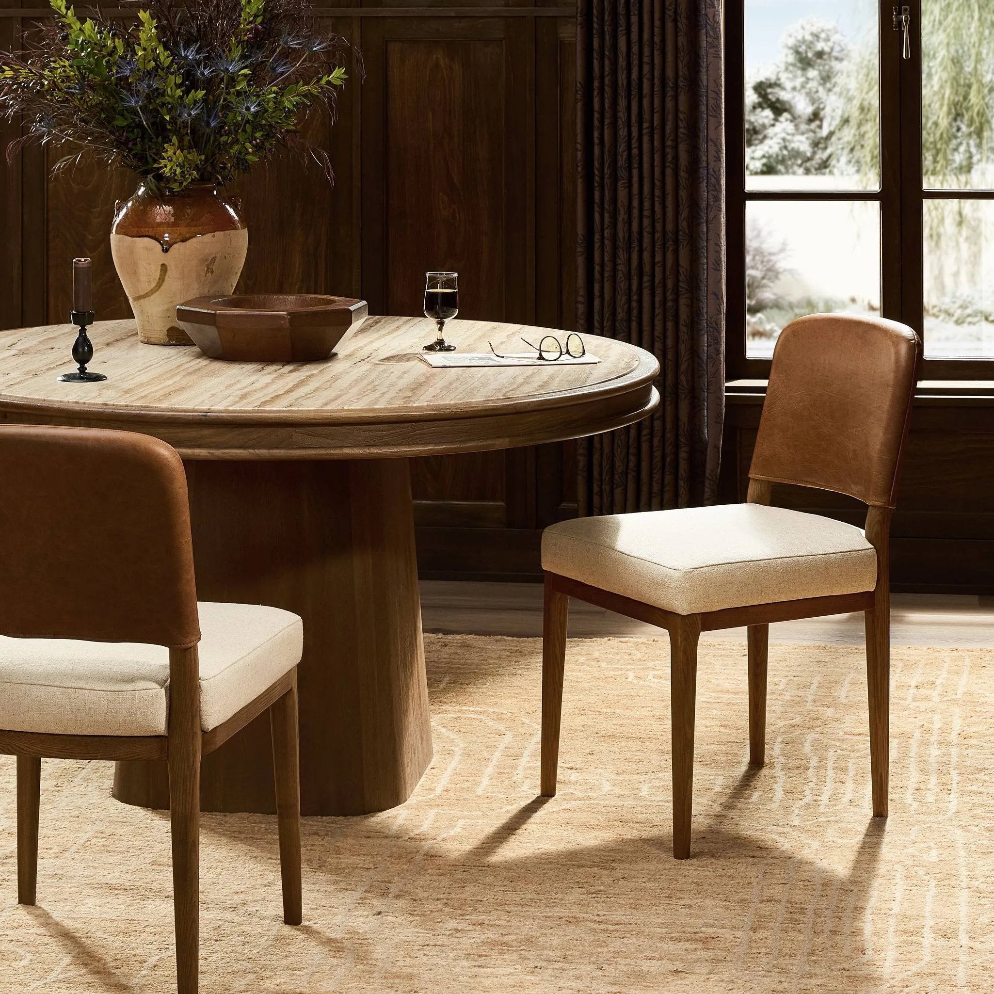 The classic material mix look you want in your dining space. Butterscotch top-grain leather with a subtle vintage look pairs with a neutral performance fabric-upholstered seat. Tapered legs and an armless silhouette look timelessly chic. Amethyst Home provides interior design, new home construction design consulting, vintage area rugs, and lighting in the Park City metro area.