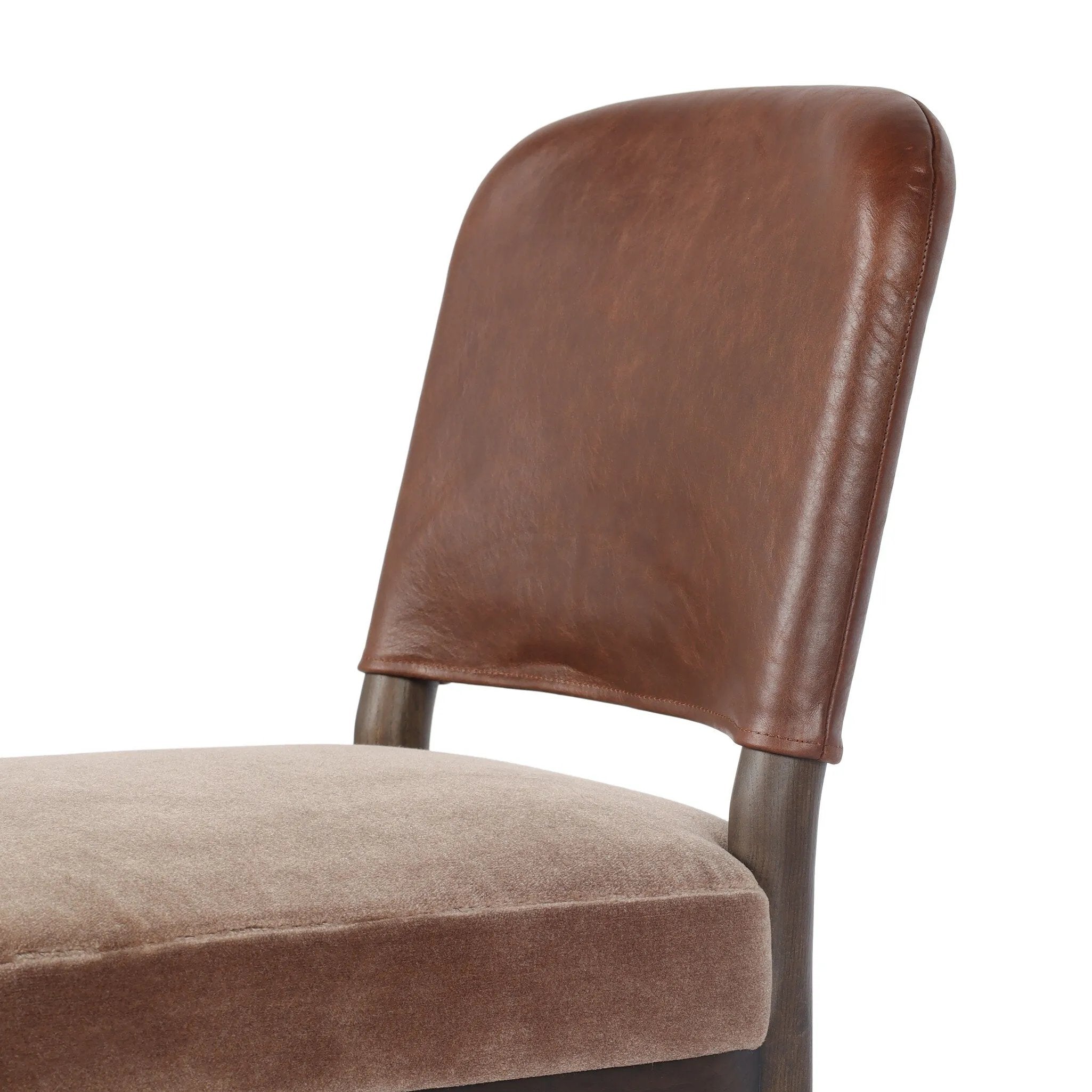 A moody, mixed material look that stands out. A velvety, wool-blend seat and top-grain leather, seat back are framed by solid