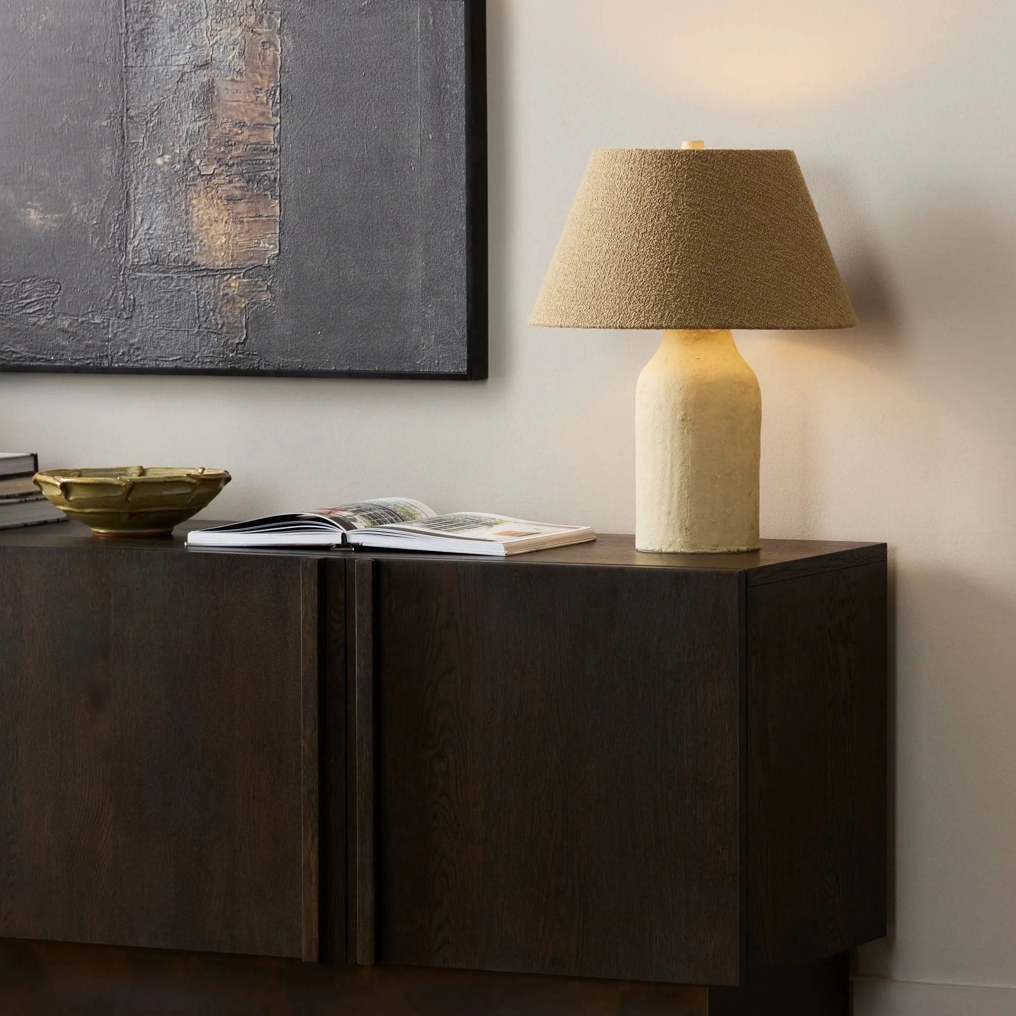 Craft warmth in any space with a table lamp made from clay and paper mache. With a fluid shape inspired by an antique jug, this lamp is perfect for bringing extra light to your workspace or bedside reading ritual Amethyst Home provides interior design, new home construction design consulting, vintage area rugs, and lighting in the Laguna Beach metro area.