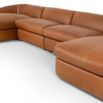 Soft, supple top-grain leather with a warm cognac hue meets vintage vibes with modern comfort. Intricate rouching along the back and corners gives each piece of this four-piece sectional a handcrafted, tailored feel, while feather-wrapped cushioning and spring suspension invite comfortable lounging Amethyst Home provides interior design, new home construction design consulting, vintage area rugs, and lighting in the Austin metro area.