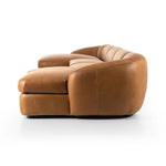 Soft, supple top-grain leather with a warm cognac hue meets vintage vibes with modern comfort. Intricate rouching along the back and corners gives each piece of this four-piece sectional a handcrafted, tailored feel, while feather-wrapped cushioning and spring suspension invite comfortable lounging Amethyst Home provides interior design, new home construction design consulting, vintage area rugs, and lighting in the Des Moines metro area.