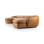 Soft, supple top-grain leather with a warm cognac hue meets vintage vibes with modern comfort. Intricate rouching along the back and corners gives each piece of this four-piece sectional a handcrafted, tailored feel, while feather-wrapped cushioning and spring suspension invite comfortable lounging Amethyst Home provides interior design, new home construction design consulting, vintage area rugs, and lighting in the Kansas City metro area.
