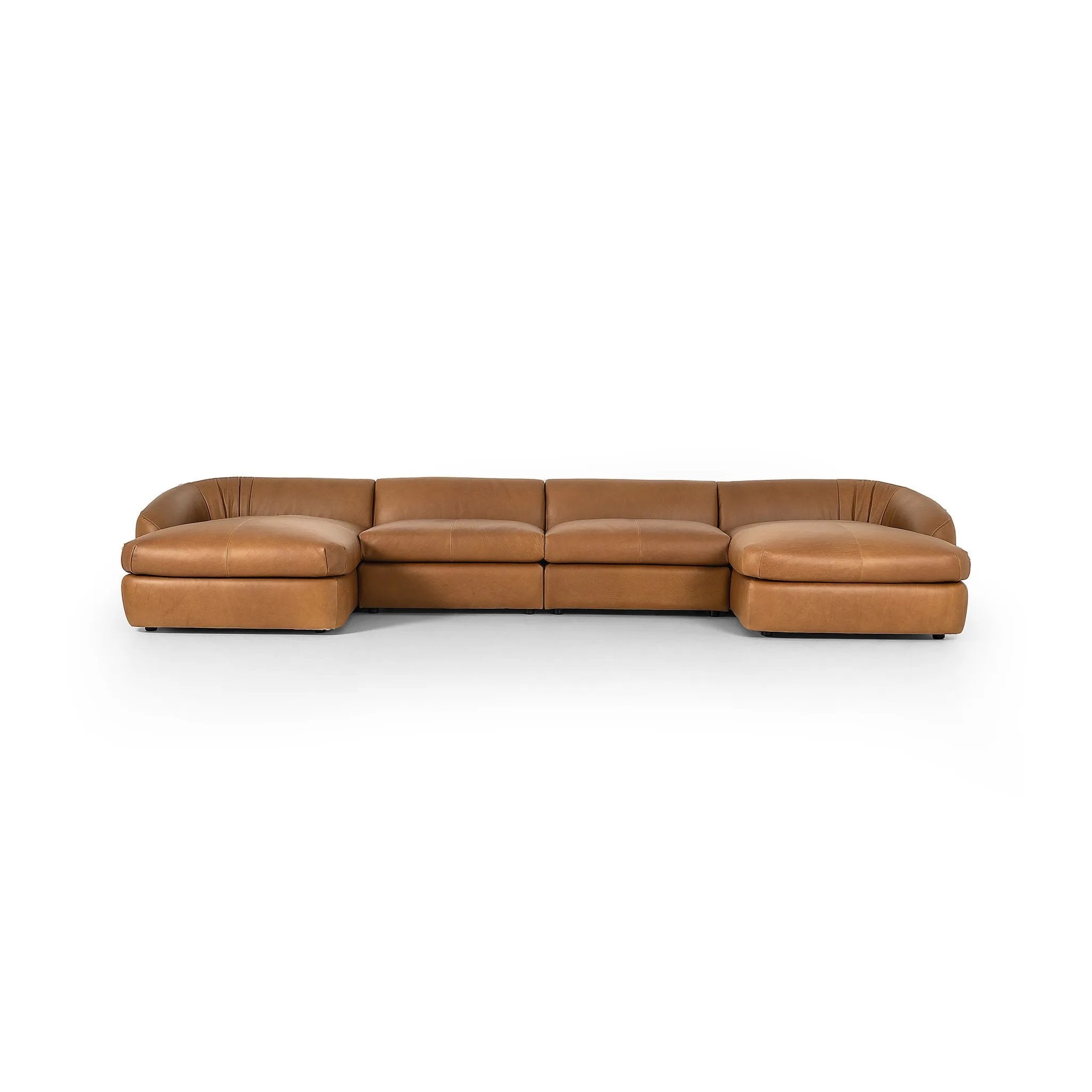 Soft, supple top-grain leather with a warm cognac hue meets vintage vibes with modern comfort. Intricate rouching along the back and corners gives each piece of this four-piece sectional a handcrafted, tailored feel, while feather-wrapped cushioning and spring suspension invite comfortable lounging Amethyst Home provides interior design, new home construction design consulting, vintage area rugs, and lighting in the Laguna Beach metro area.