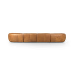 Soft, supple top-grain leather with a warm cognac hue meets vintage vibes with modern comfort. Intricate rouching along the back and corners gives each piece of this four-piece sectional a handcrafted, tailored feel, while feather-wrapped cushioning and spring suspension invite comfortable lounging Amethyst Home provides interior design, new home construction design consulting, vintage area rugs, and lighting in the Tampa metro area.
