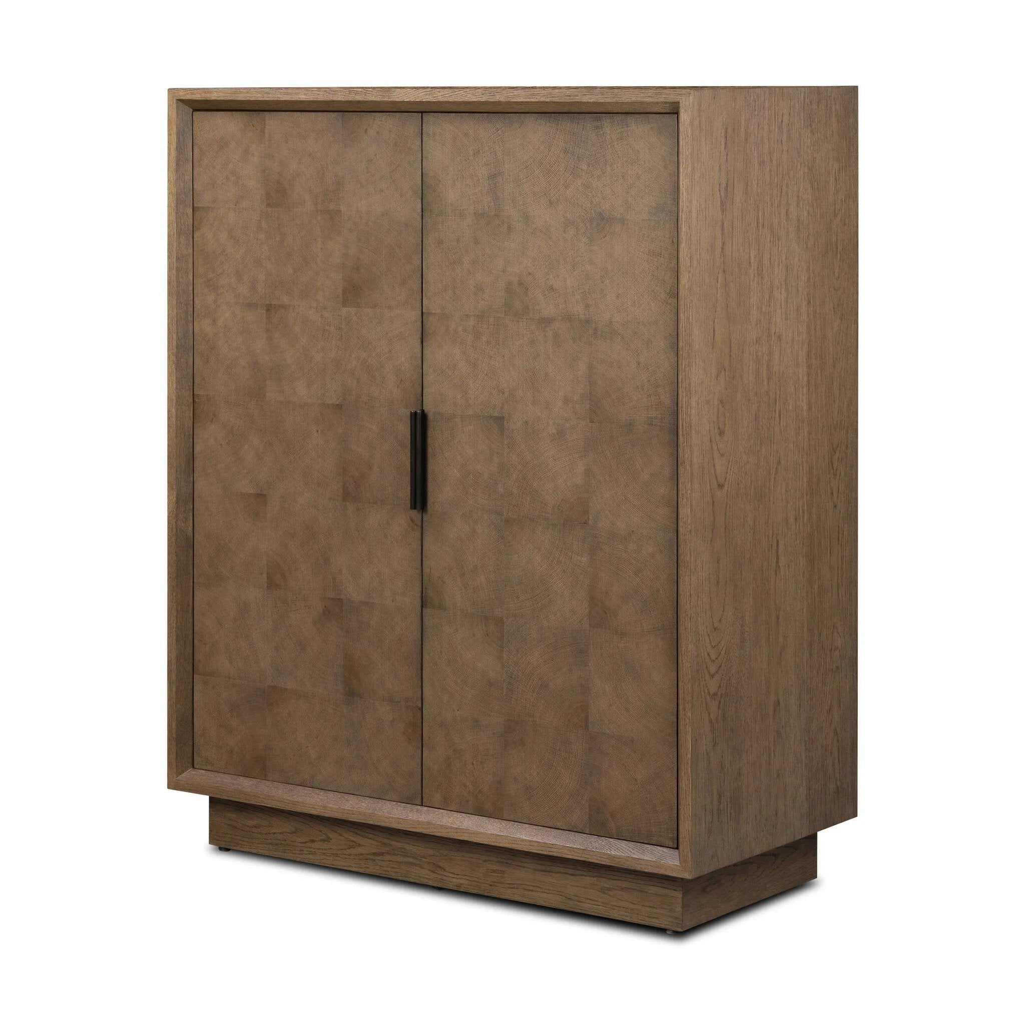 Grounding and stunning. We paired a modern frame and chunky base with door panels featuring oyster cuts of oak that take a specialized skill to create. Each cut captures the story of the wood and brings a natural, organic rhythm to the entire cabinet, and any space. Amethyst Home provides interior design, new home construction design consulting, vintage area rugs, and lighting in the Portland metro area.