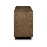 Grounding and stunning. We paired a modern frame and chunky base with door panels featuring oyster cuts of oak that take a specialized skill to create. Each cut captures the story of the wood and brings a natural, organic rhythm to the entire sideboard, and any space. Amethyst Home provides interior design, new home construction design consulting, vintage area rugs, and lighting in the Dallas metro area.