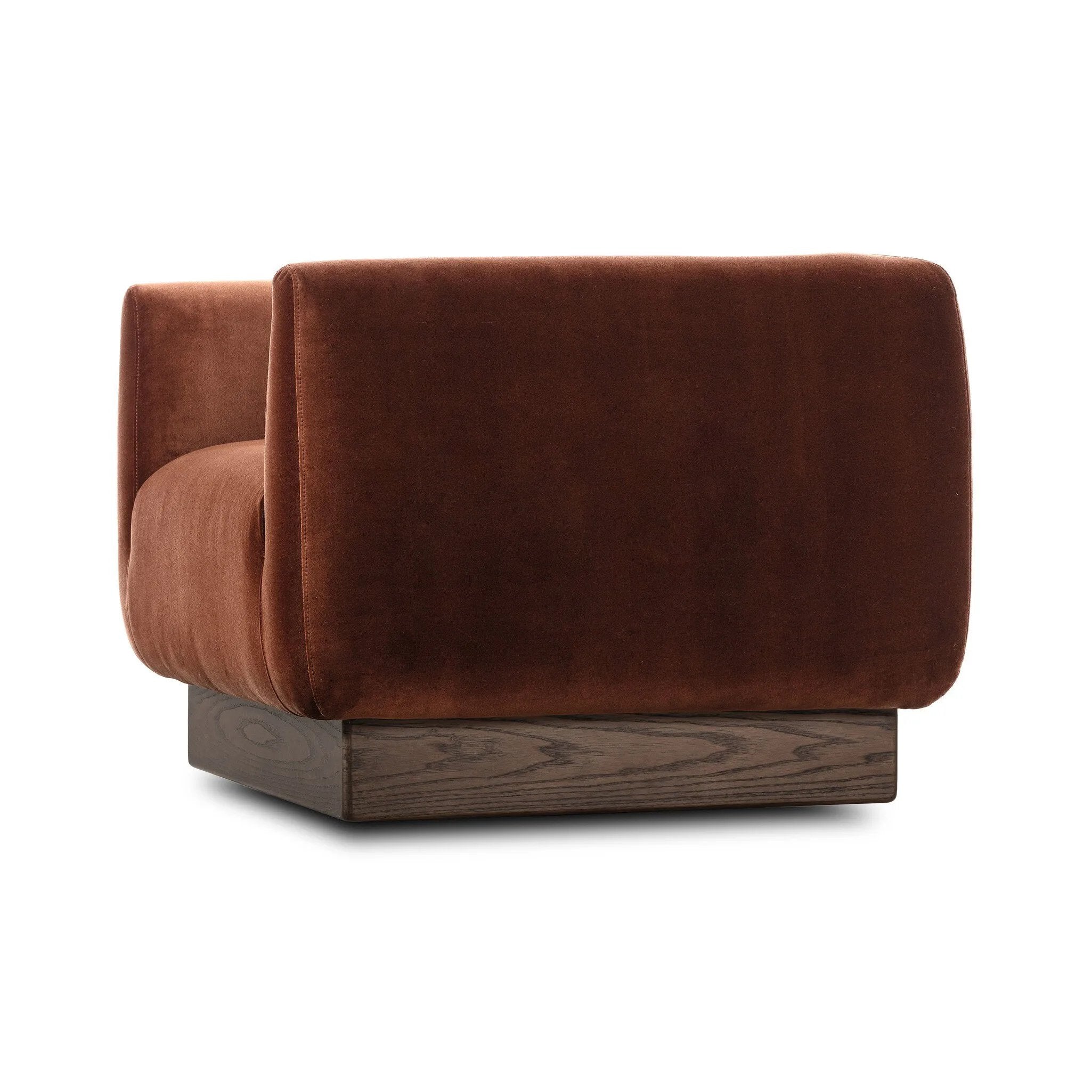Velvety upholstery in a deep auburn hue covers clean-angled, deeply cushioned seating with a 360-degree swivel base for relaxed lounging and conversation Amethyst Home provides interior design, new home construction design consulting, vintage area rugs, and lighting in the Kansas City metro area.