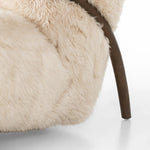 This versatile accent chair is upholstered in a faux Mongolian shearling with a textural high pile. A contrasting, chunky parawood frame hugs the seat and is wire-brushed for a warm, vintage feel Amethyst Home provides interior design, new home construction design consulting, vintage area rugs, and lighting in the Austin metro area.