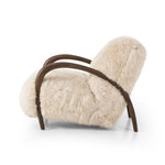 This versatile accent chair is upholstered in a faux Mongolian shearling with a textural high pile. A contrasting, chunky parawood frame hugs the seat and is wire-brushed for a warm, vintage feel Amethyst Home provides interior design, new home construction design consulting, vintage area rugs, and lighting in the Monterey metro area.