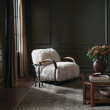 This versatile accent chair is upholstered in a faux Mongolian shearling with a textural high pile. A contrasting, chunky parawood frame hugs the seat and is wire-brushed for a warm, vintage feel Amethyst Home provides interior design, new home construction design consulting, vintage area rugs, and lighting in the Nashville metro area.