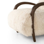 This versatile accent chair is upholstered in a faux Mongolian shearling with a textural high pile. A contrasting, chunky parawood frame hugs the seat and is wire-brushed for a warm, vintage feel Amethyst Home provides interior design, new home construction design consulting, vintage area rugs, and lighting in the Newport Beach metro area.