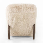 This versatile accent chair is upholstered in a faux Mongolian shearling with a textural high pile. A contrasting, chunky parawood frame hugs the seat and is wire-brushed for a warm, vintage feel Amethyst Home provides interior design, new home construction design consulting, vintage area rugs, and lighting in the Omaha metro area.