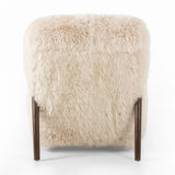 This versatile accent chair is upholstered in a faux Mongolian shearling with a textural high pile. A contrasting, chunky parawood frame hugs the seat and is wire-brushed for a warm, vintage feel Amethyst Home provides interior design, new home construction design consulting, vintage area rugs, and lighting in the Omaha metro area.