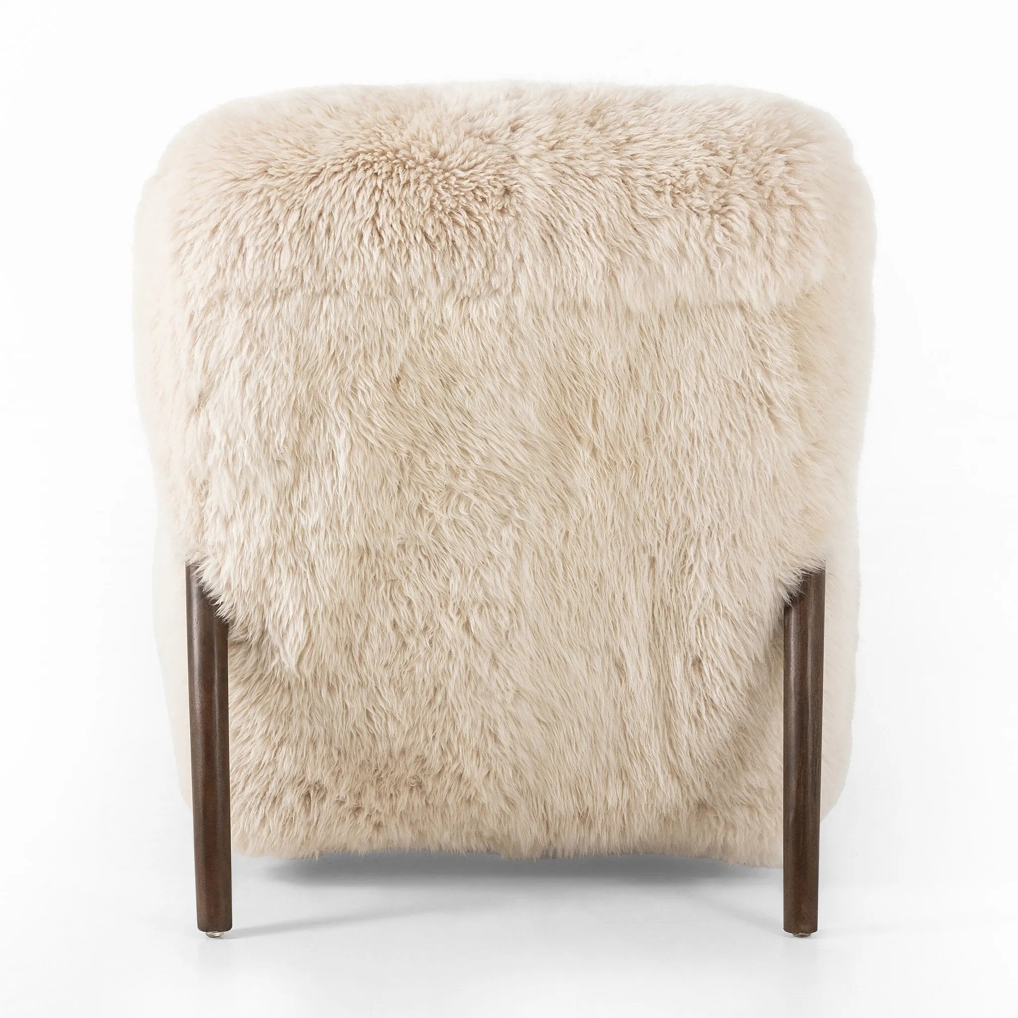 This versatile accent chair is upholstered in a faux Mongolian shearling with a textural high pile. A contrasting, chunky parawood frame hugs the seat and is wire-brushed for a warm, vintage feel Amethyst Home provides interior design, new home construction design consulting, vintage area rugs, and lighting in the Omaha metro area.
