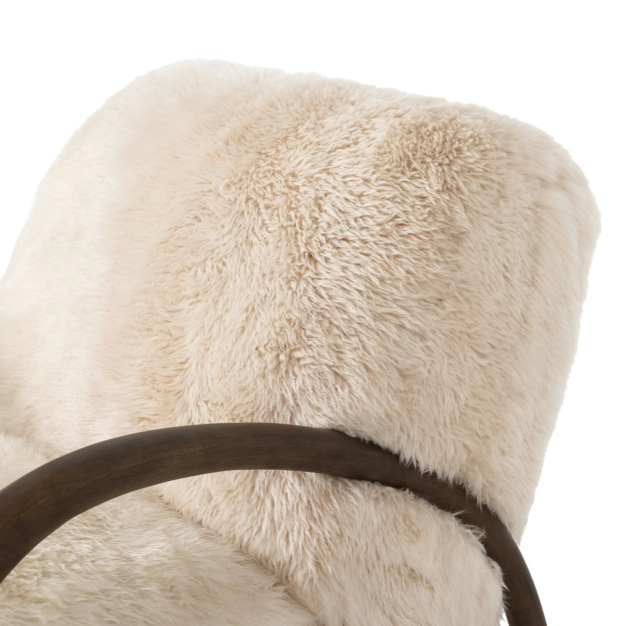 This versatile accent chair is upholstered in a faux Mongolian shearling with a textural high pile. A contrasting, chunky parawood frame hugs the seat and is wire-brushed for a warm, vintage feel Amethyst Home provides interior design, new home construction design consulting, vintage area rugs, and lighting in the Salt Lake City metro area.