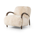 This versatile accent chair is upholstered in a faux Mongolian shearling with a textural high pile. A contrasting, chunky parawood frame hugs the seat and is wire-brushed for a warm, vintage feel Amethyst Home provides interior design, new home construction design consulting, vintage area rugs, and lighting in the Washington metro area.