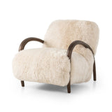 This versatile accent chair is upholstered in a faux Mongolian shearling with a textural high pile. A contrasting, chunky parawood frame hugs the seat and is wire-brushed for a warm, vintage feel Amethyst Home provides interior design, new home construction design consulting, vintage area rugs, and lighting in the Washington metro area.